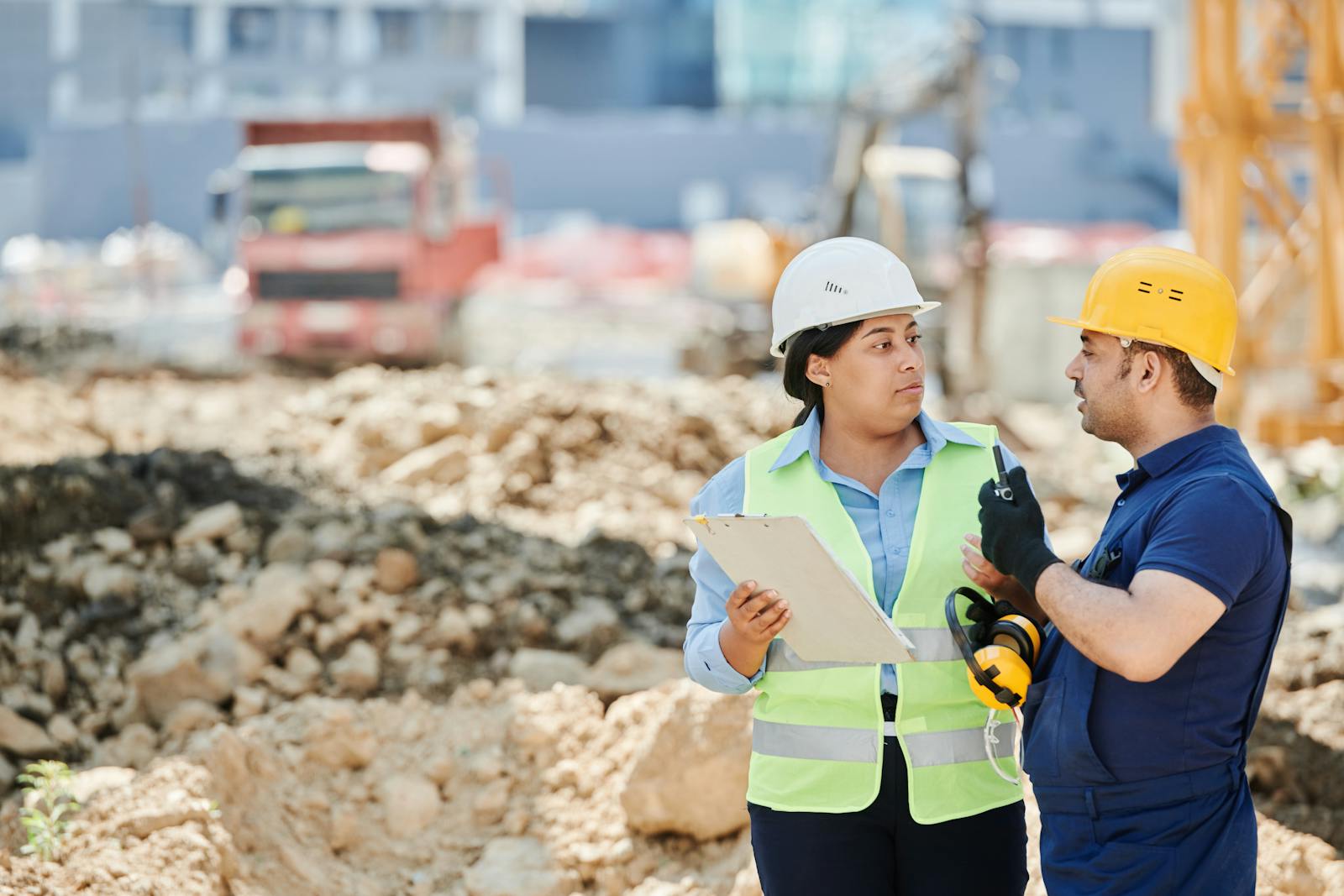 A field crew on the job, hard hats and clipboard in hand